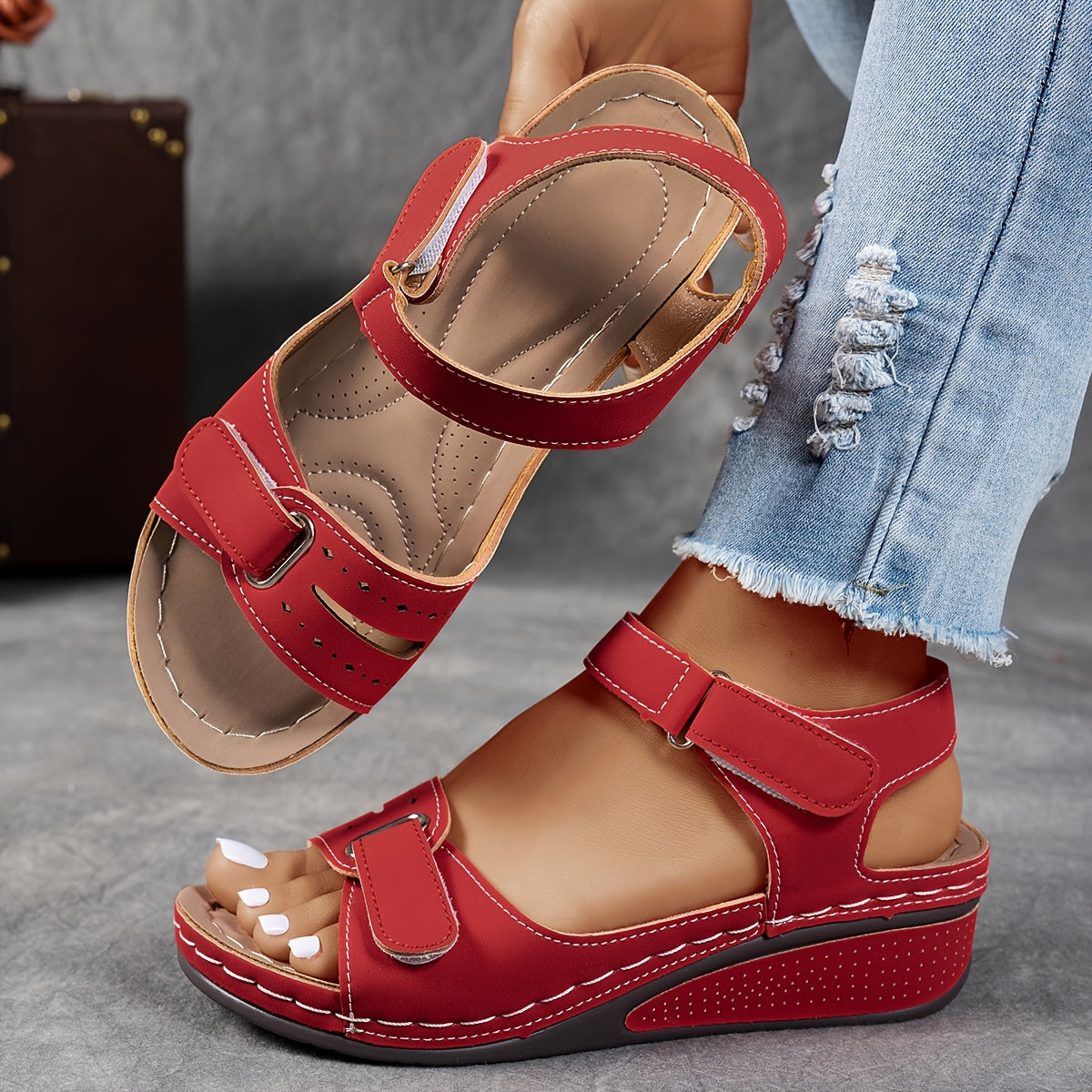 Red orthopedic comfort sandals with hook-and-loop straps and cushioned wedge sole
