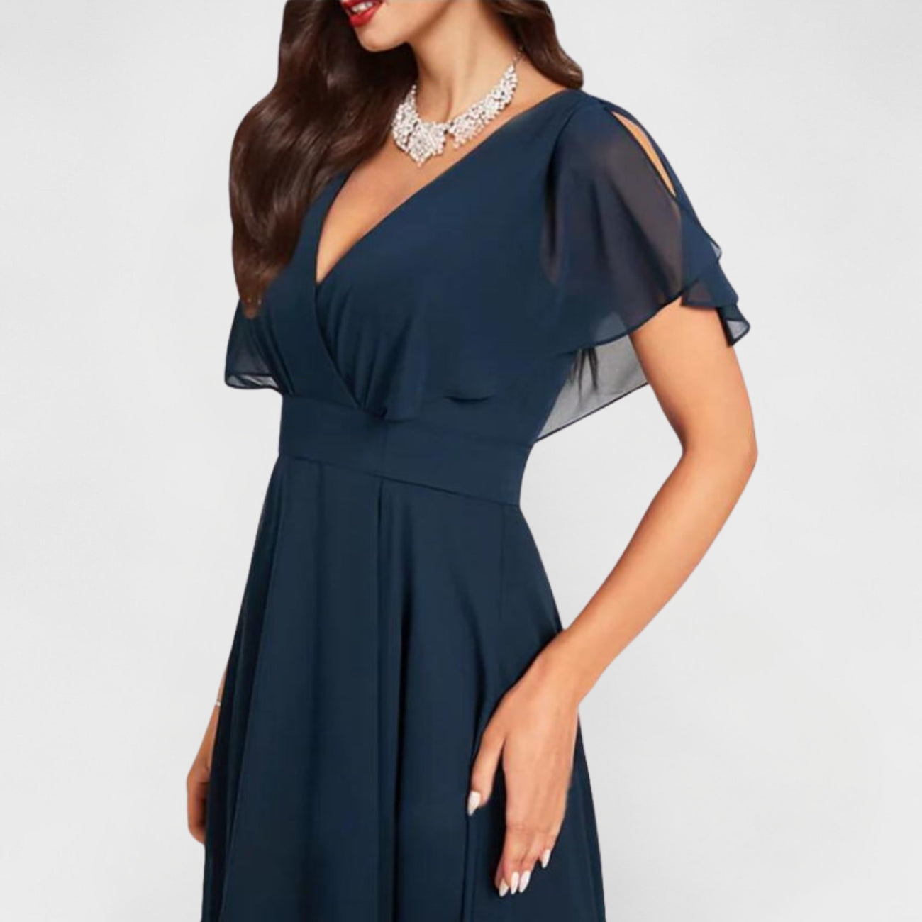 Catalina V-neck dress with draped bodice, short flutter sleeves, and A-line midi hem