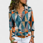 Elegant button-up blouse with multicolor geometric triangle pattern, collared, rolled sleeves