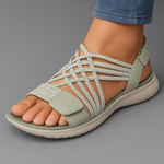 Orthopedic sandal in light gray with sage details, open toe, and cushioned sole.