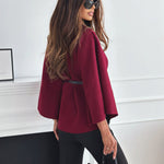 Women's burgundy jacket side view with flared sleeves and belted peplum waist