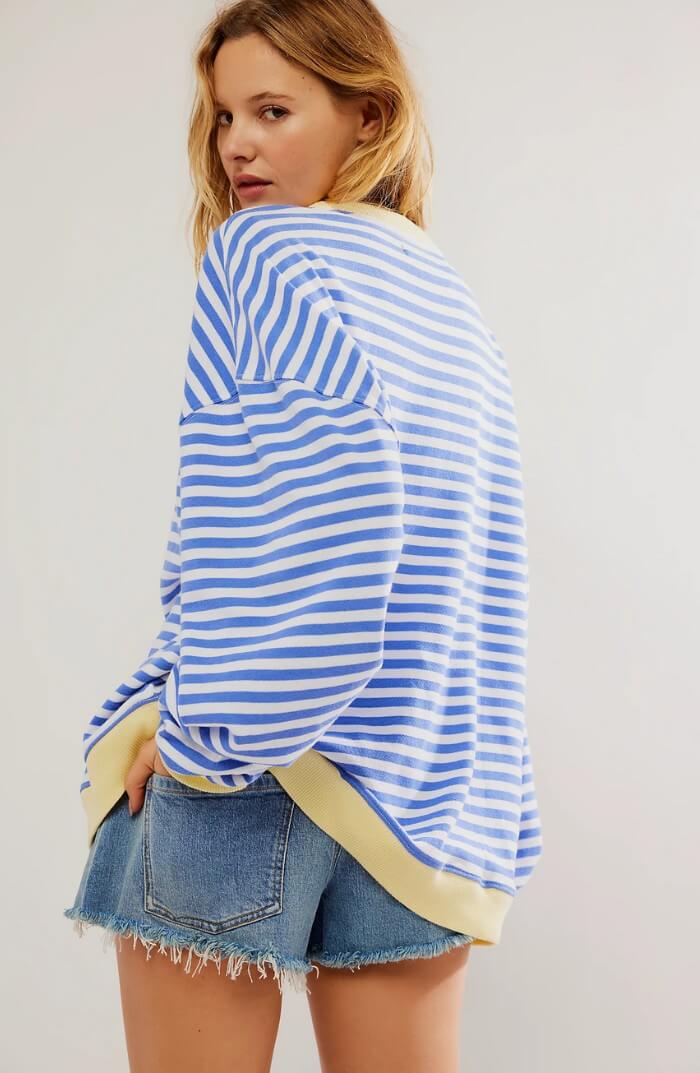 Light blue and white striped relaxed pullover with long sleeves, crew neck