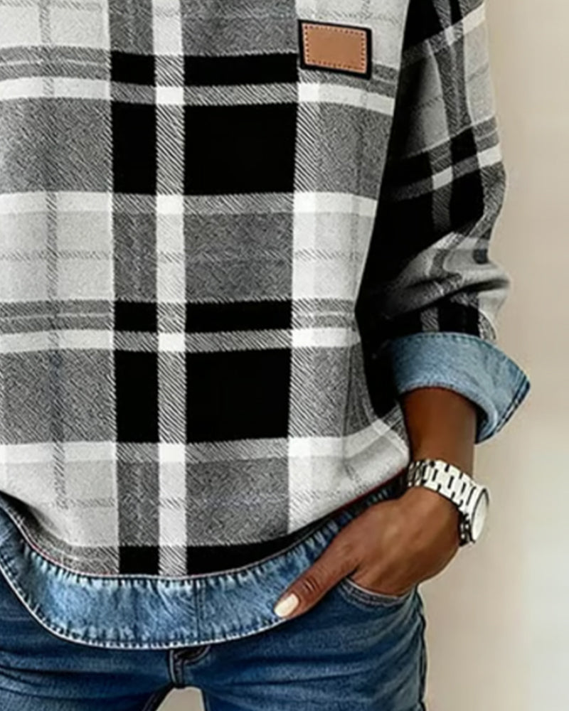 Women’s flannel pullover close-up: black-and-white plaid with denim trim and patch