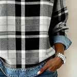 Women’s flannel pullover close-up: black-and-white plaid with denim trim and patch