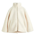 Cream sherpa zip-up winter jacket with stand collar and two front flap pockets