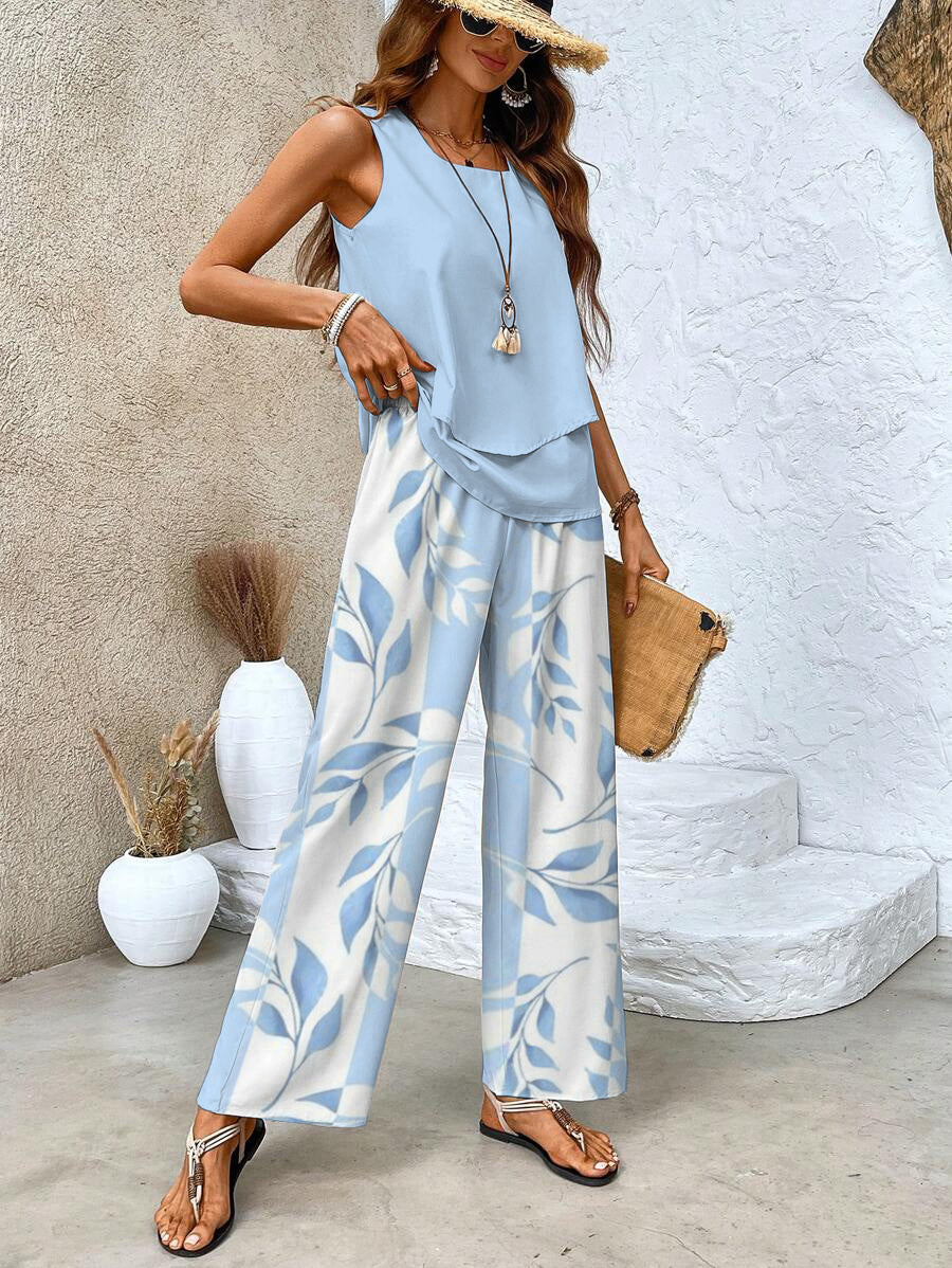Light blue sleeveless layered top and wide-leg pants set with leaf print, full length