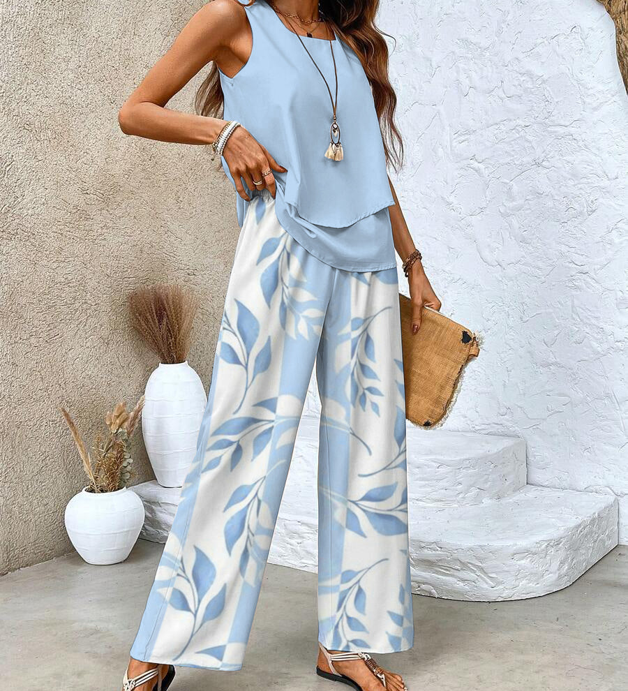 Light blue sleeveless layered top and wide-leg pants set with leaf print, full length