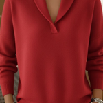 Red V-neck knit sweater with long sleeves and ribbed cuffs and hem