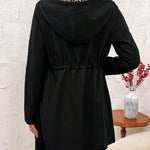 Black hooded reversible jacket with long sleeves, gathered back detail, zipper front