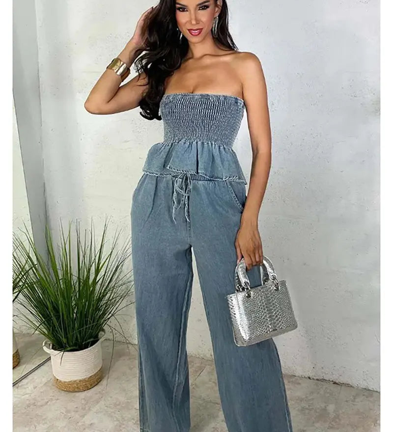 Light blue denim two-piece set with strapless smocked peplum top and wide-leg pants