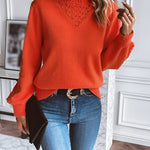 Orange knit sweater with textured V yoke, long sleeves, ribbed hem and cuffs