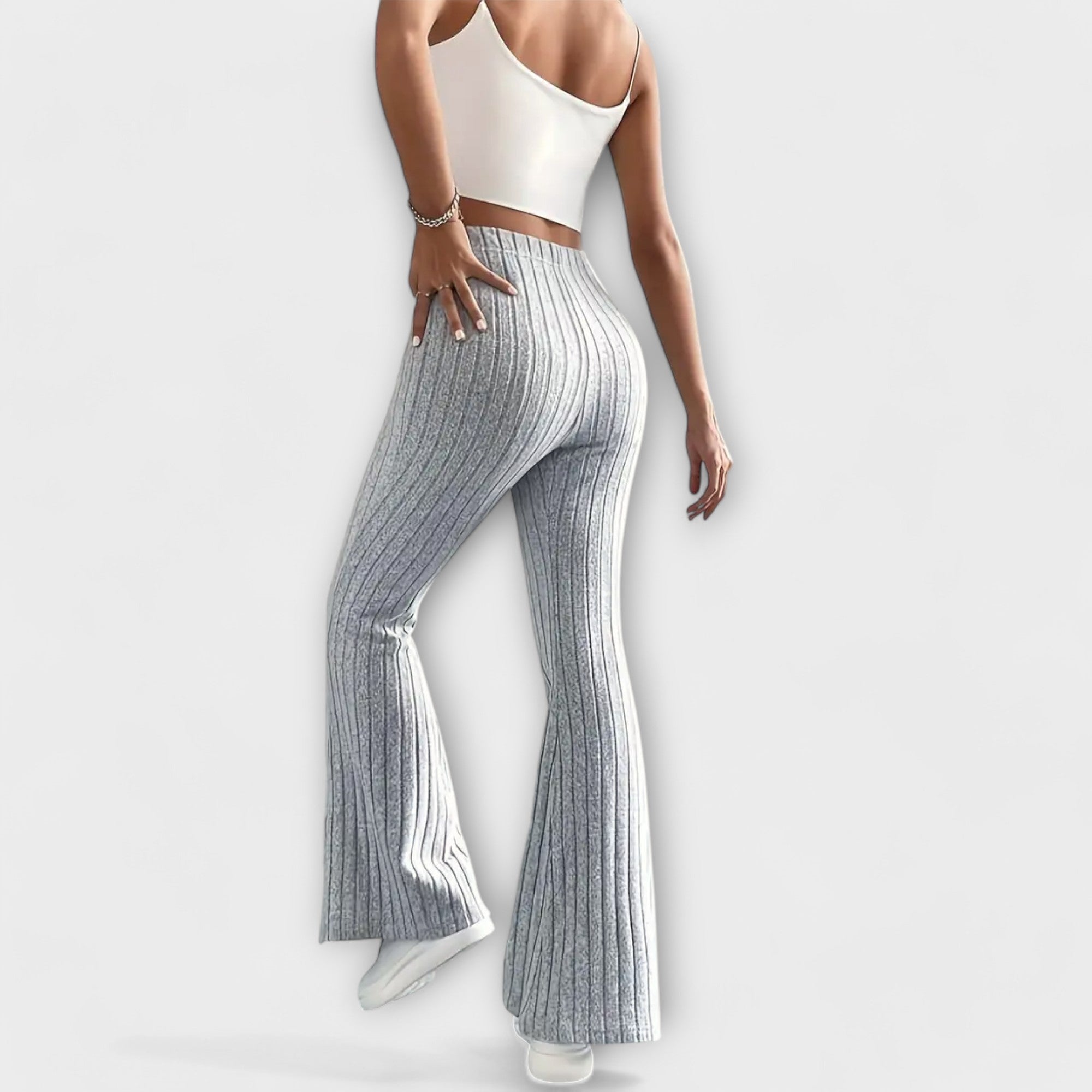 Grey ribbed knit high-waist flared pants with wide flare at the hem