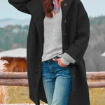Long black hooded coat with button front and side pockets