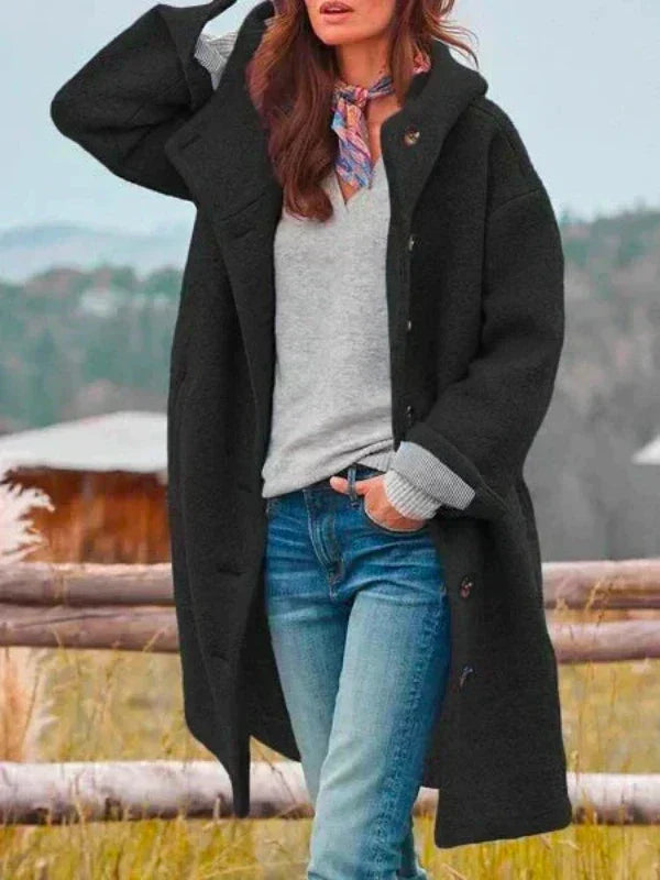 Long black hooded coat with button front and side pockets