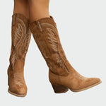 Brown suede mid-calf western boots with decorative stitched embroidery and block heel