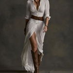 White long linen dress with V-neck buttons, reverse collar, wrap slit and belt.