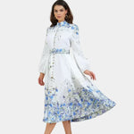 Blue floral midi dress with high neck, long sleeves, gathered waist and full skirt