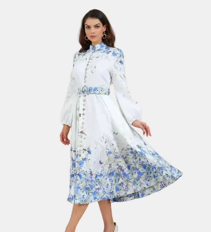Blue floral midi dress with high neck, long sleeves, gathered waist and full skirt