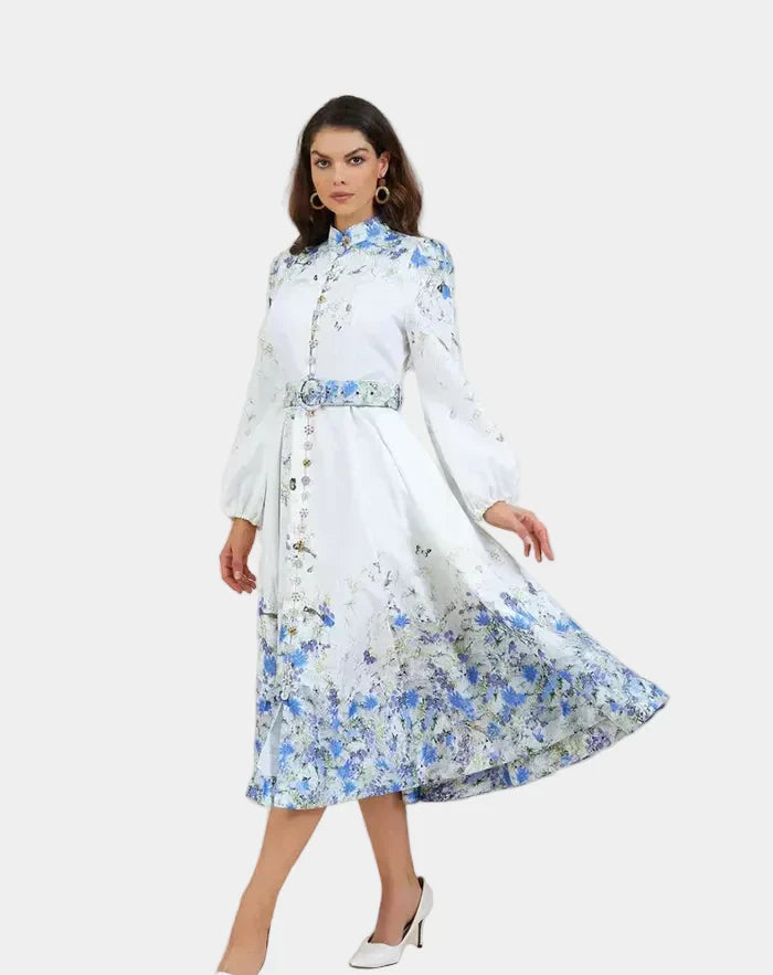 Blue floral midi dress with high neck, long sleeves, gathered waist and full skirt