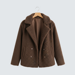 Brown sherpa-style puffer jacket with wide lapels, double-breasted buttons, and long sleeves