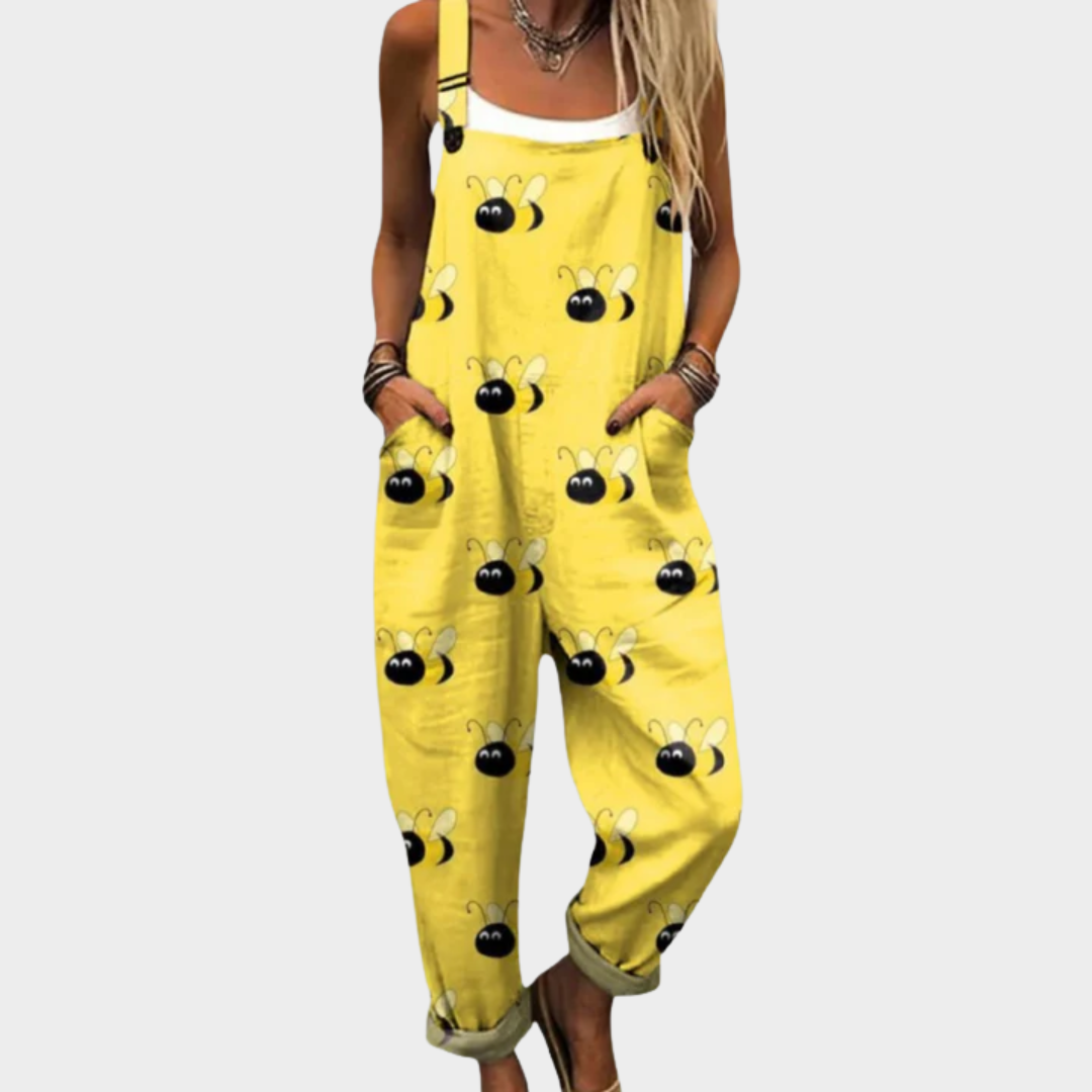 Yellow loose dungarees with playful cartoon bee print, adjustable straps