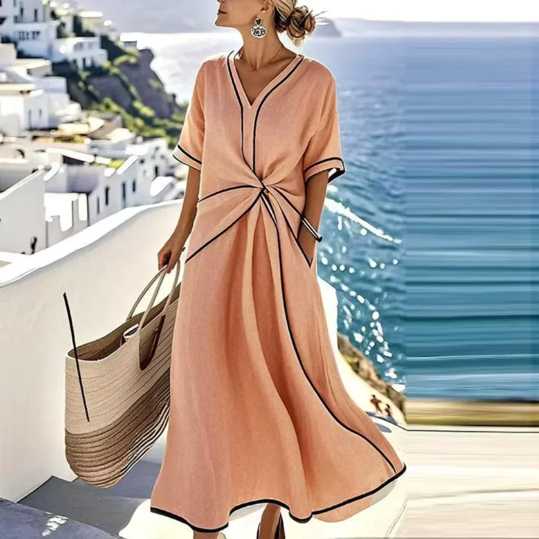 Peach maxi wrap dress with V-neck, short sleeves, knot waist and contrast trim