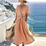 Peach maxi wrap dress with V-neck, short sleeves, knot waist and contrast trim
