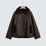 Women’s faux leather jacket with dark shearling collar and button front