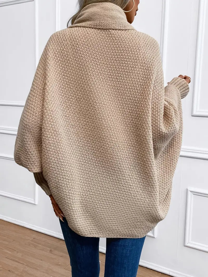 Beige knit cardigan draped back view, open front, long sleeves.