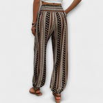 Black-brown patterned wide-leg harem pants with elastic waistband and elastic ankle cuffs