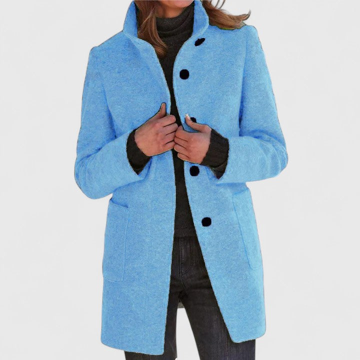 Light blue classic button-front coat with notch lapels, long sleeves, and side pockets