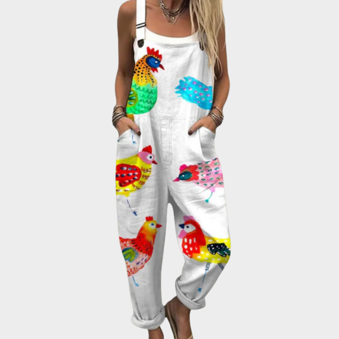 White loose-fit overalls with multicolor bird print, bib front and suspenders