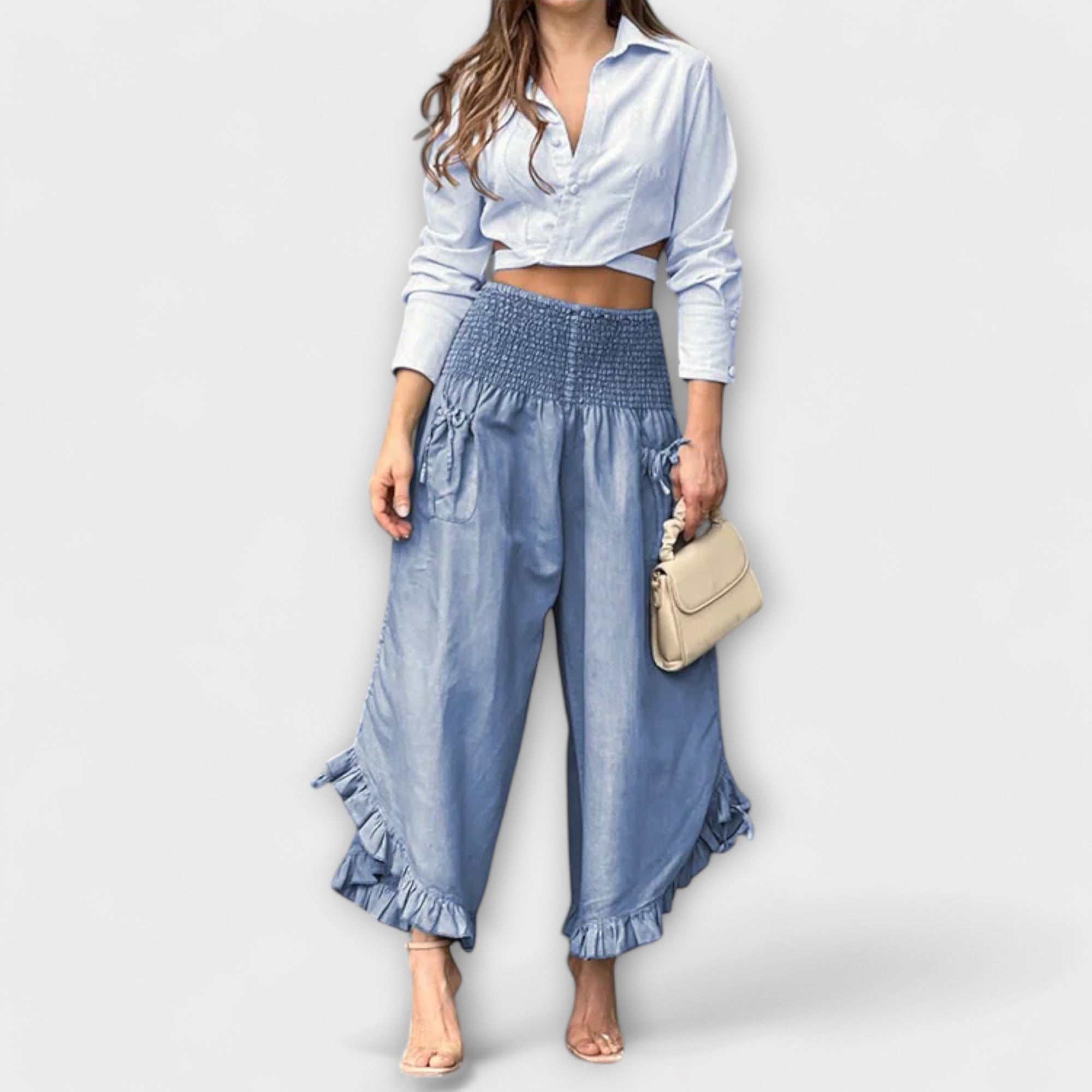Blue wide-leg linen pants with elastic waist and ruffle cuffs