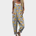 Loose printed overalls, gray with yellow animal face print and adjustable shoulder straps