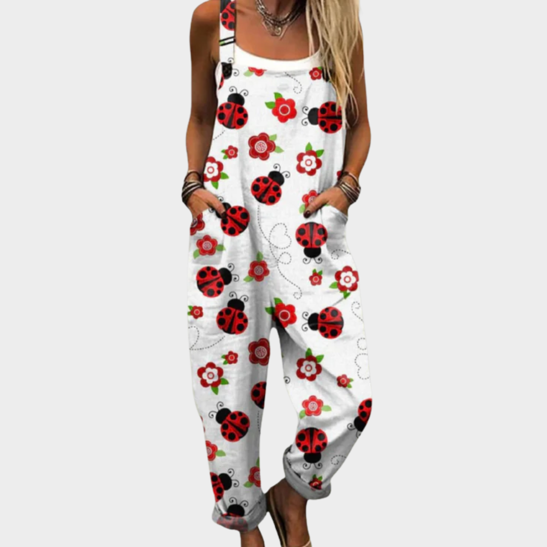 Loose printed dungarees in white with red ladybugs and flowers, front bib