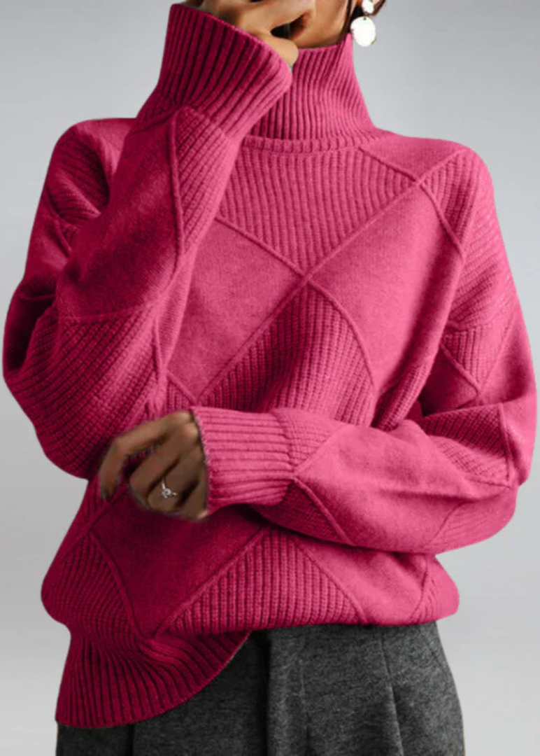 Magenta high-neck sweater with ribbed turtleneck and diagonal knit panel detail.