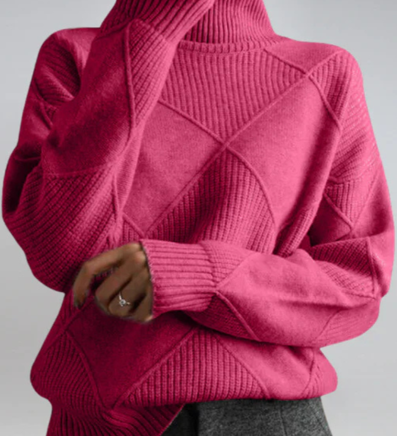 Magenta high-neck sweater with ribbed turtleneck and diagonal knit panel detail.