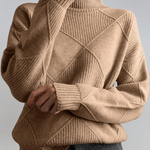 Taupe high-neck sweater with ribbed turtleneck and diagonal knit panel detail.