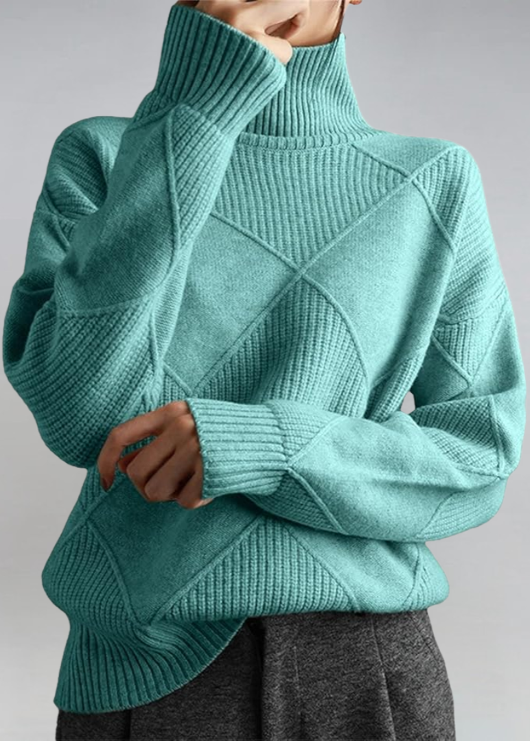 Teal green high-neck sweater with ribbed turtleneck and diagonal knit panel detail.