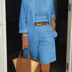 Blue blazer and shorts set with belted waist detail, relaxed fit sleeves.