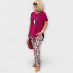 Elegant summer two-piece set with burgundy top and textured maroon-and-white patterned pants
