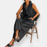 Black sleeveless jumpsuit with flap pockets and gathered waist seam