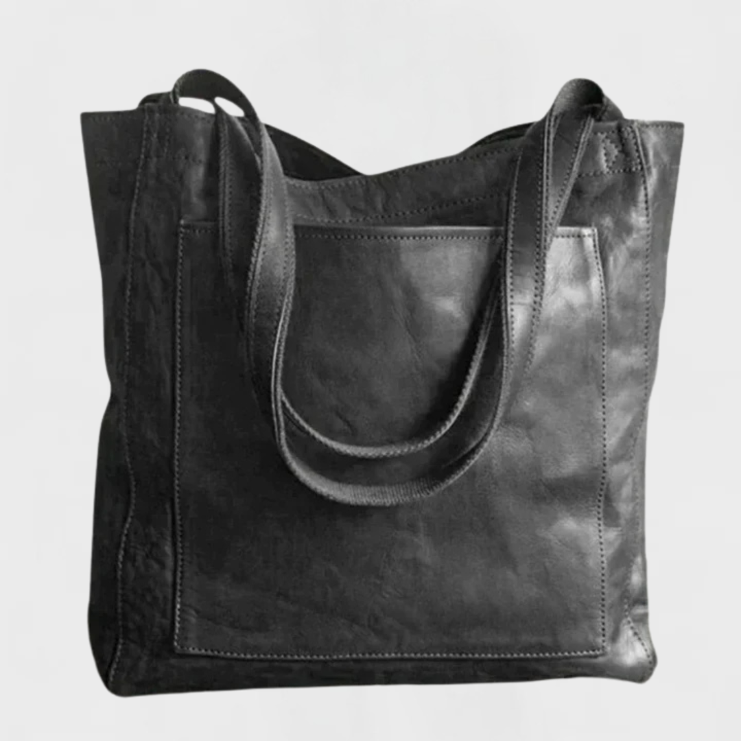 Black leather tote bag with double top handles and front stitched panel.