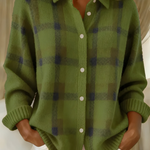 Green plaid knit cardigan with button-front, V-neck collar, long sleeves.
