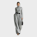 Women's turtleneck jumpsuit in light gray with contrast piping, belt, and wide legs