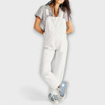 White denim loose-fit overalls with square bib and side patch pockets