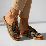 Platform slide sandals with leopard-print upper and brown tassel, open toe, tan stitched sole