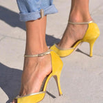 Yellow high-heel peep-toe sandals with thin ankle strap and pointed stiletto heel
