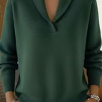 Green V-neck knit sweater with long sleeves and ribbed cuffs and hem