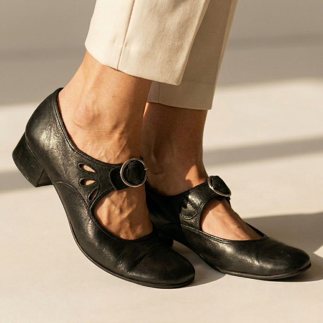 Leni pointed-heel shoes in black with instep cutout strap and round buckle